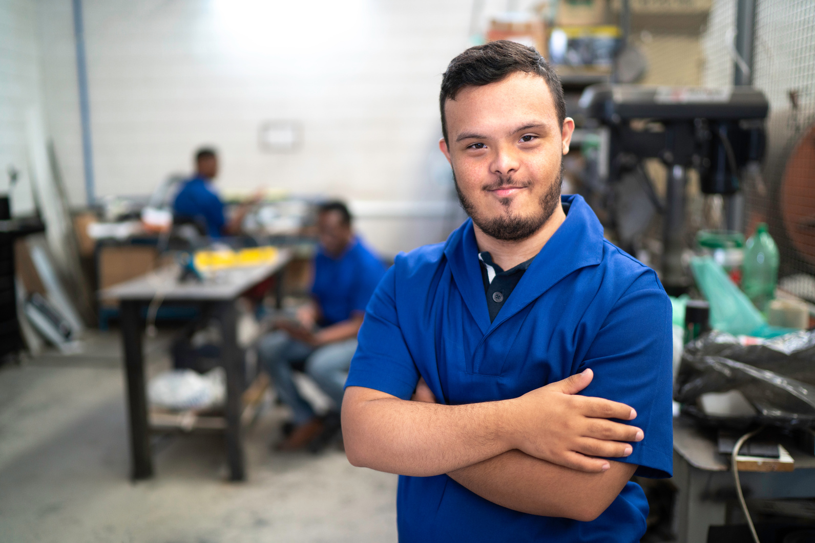 Portrait of smiling special needs employee in industry